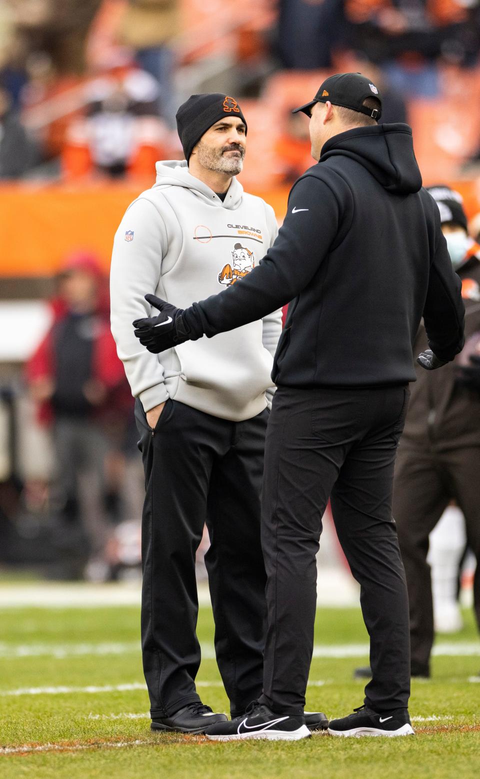 Jan 9, 2022; Cleveland, Ohio, USA; Cleveland Browns head coach Kevin Stefanski talks with Cincinnati Bengals head coach Zac Taylor during warmups before the game at FirstEnergy Stadium.