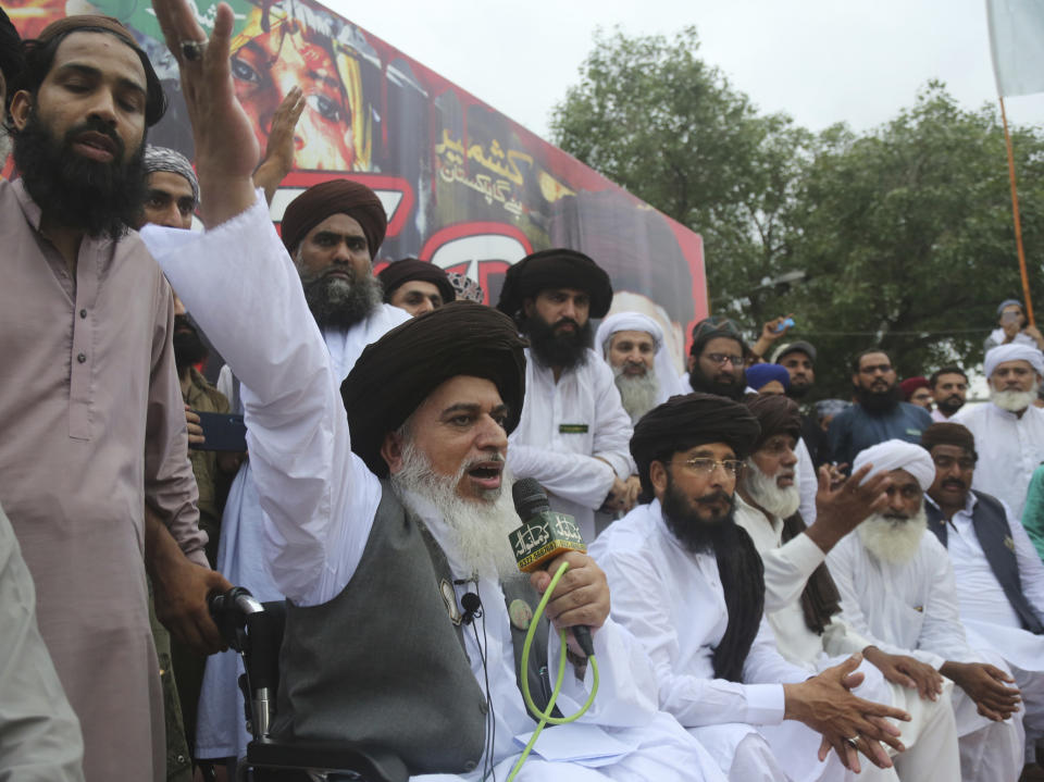 Pakistani radical cleric Khadim Hussain Rizvi addresses a rally against India in Lahore, Pakistan, Friday, Aug. 9, 2019. Thousands of activists held peaceful rallies across Pakistan to condemn India and its decisions on Kashmir. (AP Photo/K.M. Chaudhry)