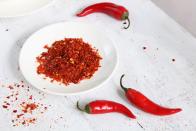 <p>“In addition to adding a kick of flavor to your favorite foods, cayenne pepper may also help increase weight loss as well,” says Dr. Axe. “This is thanks to the presence of a compound called capsaicin, which helps enhance feelings of fullness, reduce cravings and speed up your metabolism.” You can add it to smoothies, mix it in soups, or use it to boost the flavor profile of vegetables like those in this <a href="https://www.prevention.com/food-nutrition/recipes/a22666681/spiced-grilled-eggplant-recipe/" rel="nofollow noopener" target="_blank" data-ylk="slk:Spiced Grilled Eggplant with Fresh Tomato Salad;elm:context_link;itc:0;sec:content-canvas" class="link ">Spiced Grilled Eggplant with Fresh Tomato Salad</a>.</p>