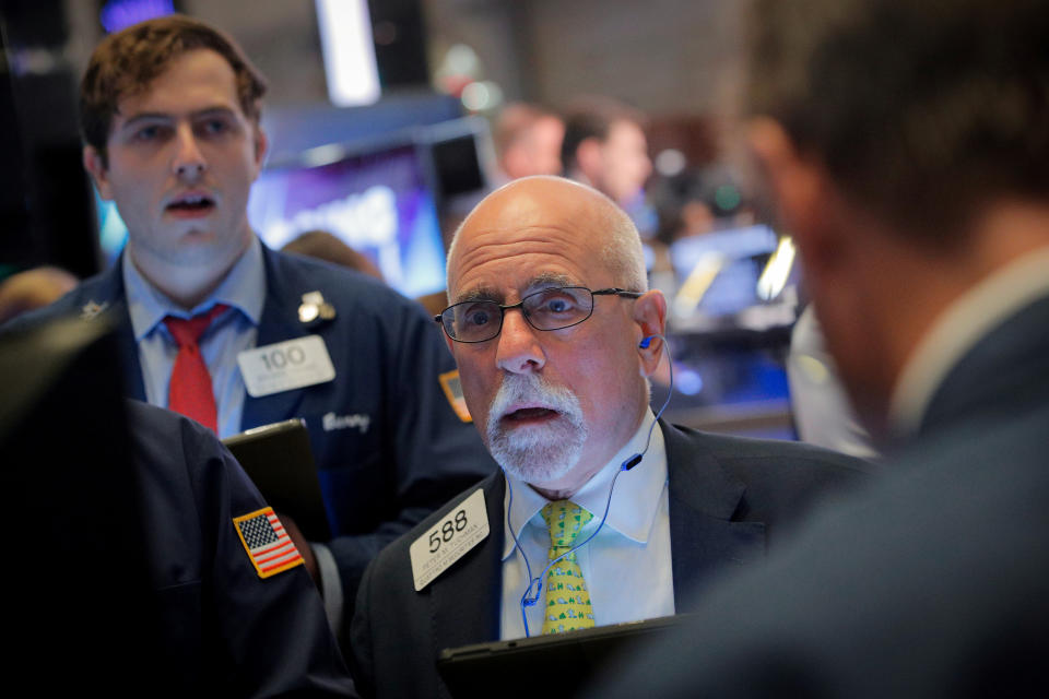 Traders work on the floor at the New York Stock Exchange (NYSE) in New York, U.S., July 31, 2019. REUTERS/Brendan McDermid