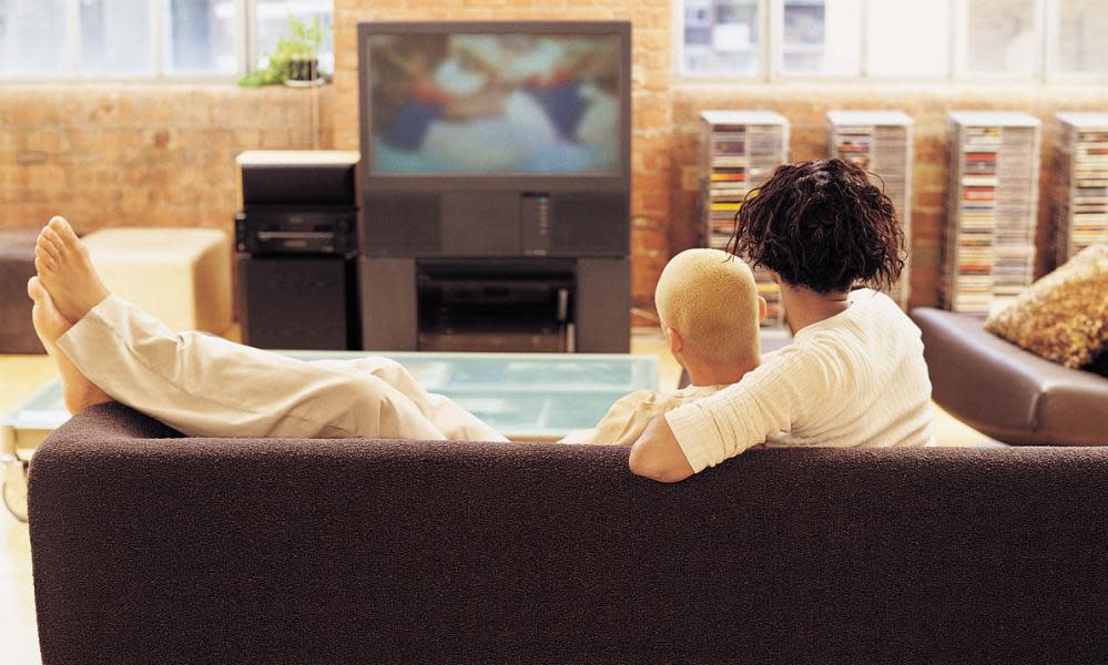 Couple lounging on sofa