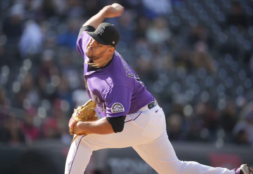 Colorado Rockies relief pitcher Carlos Estevez works against the San Francisco Giants.