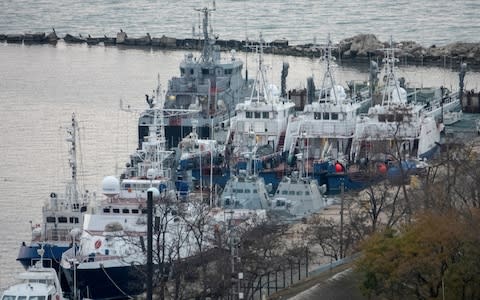 Seized Ukrainian naval ships were guarded by Russia's Coast Guard vessels in the port in Kerch, near the bridge connecting the Russian mainland with the Crimean Peninsula - Credit: REUTERS/Alla Dmitrieva