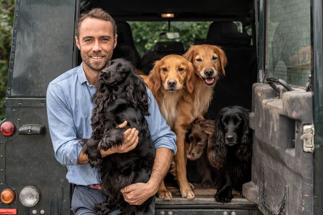 <p>Chris Terry</p> James Middleton (holding Inka) and some of his other dogs