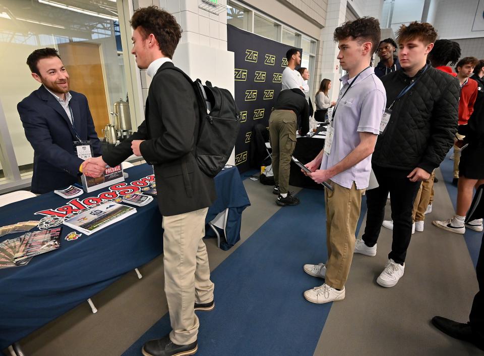 Eric Olafsen, Worcester Red Sox coordinator of marketing and Polar Park events, had a long line of students waiting to ask questions during the third annual Worcester Sports Management Summit at Worcester State University.