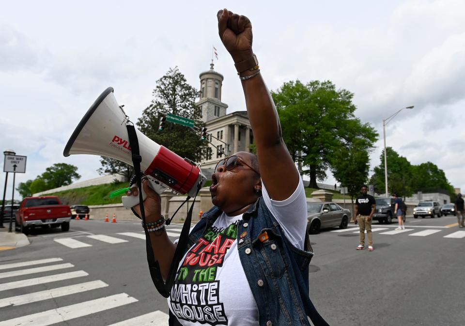 Racorol Woodard leads a group of demonstrators in a chant as they walk around the Capitol during The People vs The State of Tennessee Rally Wednesday, April 17, 2024, in Nashville, Tenn. The Equity Alliance, along with more than a dozen other grassroots groups from Nashville and around the state, held a rally in response to what organizers call “an ineffective legislative session” happening in Tennessee.