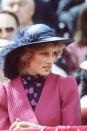 <p>Wearing a deep blue wide brim topper with a feather at her birthday celebration in Canada.</p>