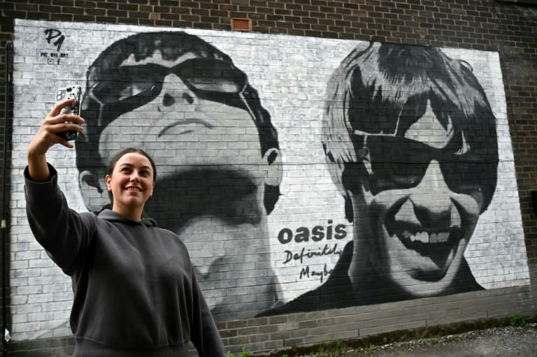 The tour announcement delighted fans who had despaired of ever seeing brothers Liam and Noel Gallagher perform together again (Paul ELLIS)