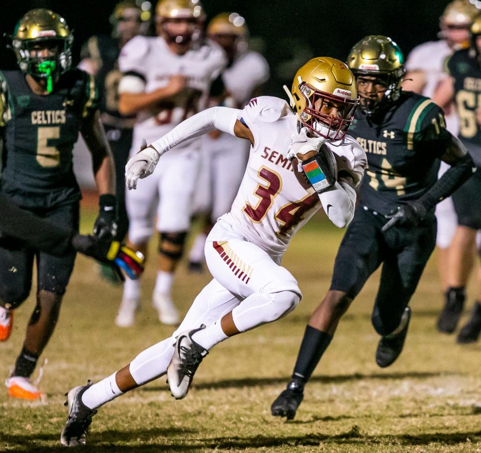 Florida State High #34 Micahi Danzy breaks upfield in the first half. Trinity Catholic lost to Florida State University High School 17-12 at Trinity Catholic High School in Ocala, FL., Friday night, November 26, 2021.[Doug Engle/Ocala Star-Banner]2021