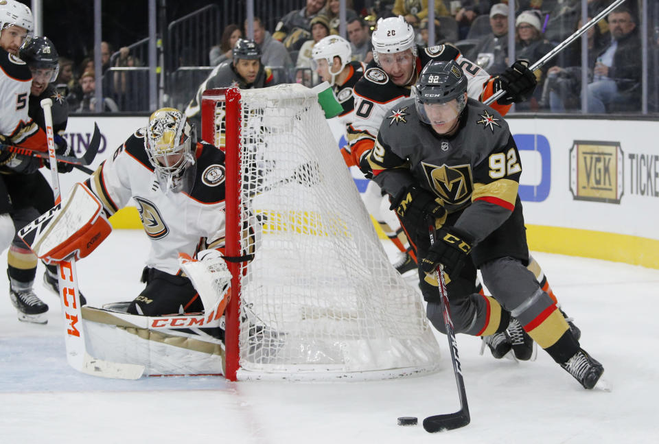 Vegas Golden Knights left wing Tomas Nosek (92) skates around Anaheim Ducks left wing Nicolas Deslauriers (20) during the second period of an NHL hockey game Tuesday, Dec. 31, 2019, in Las Vegas. (AP Photo/John Locher)