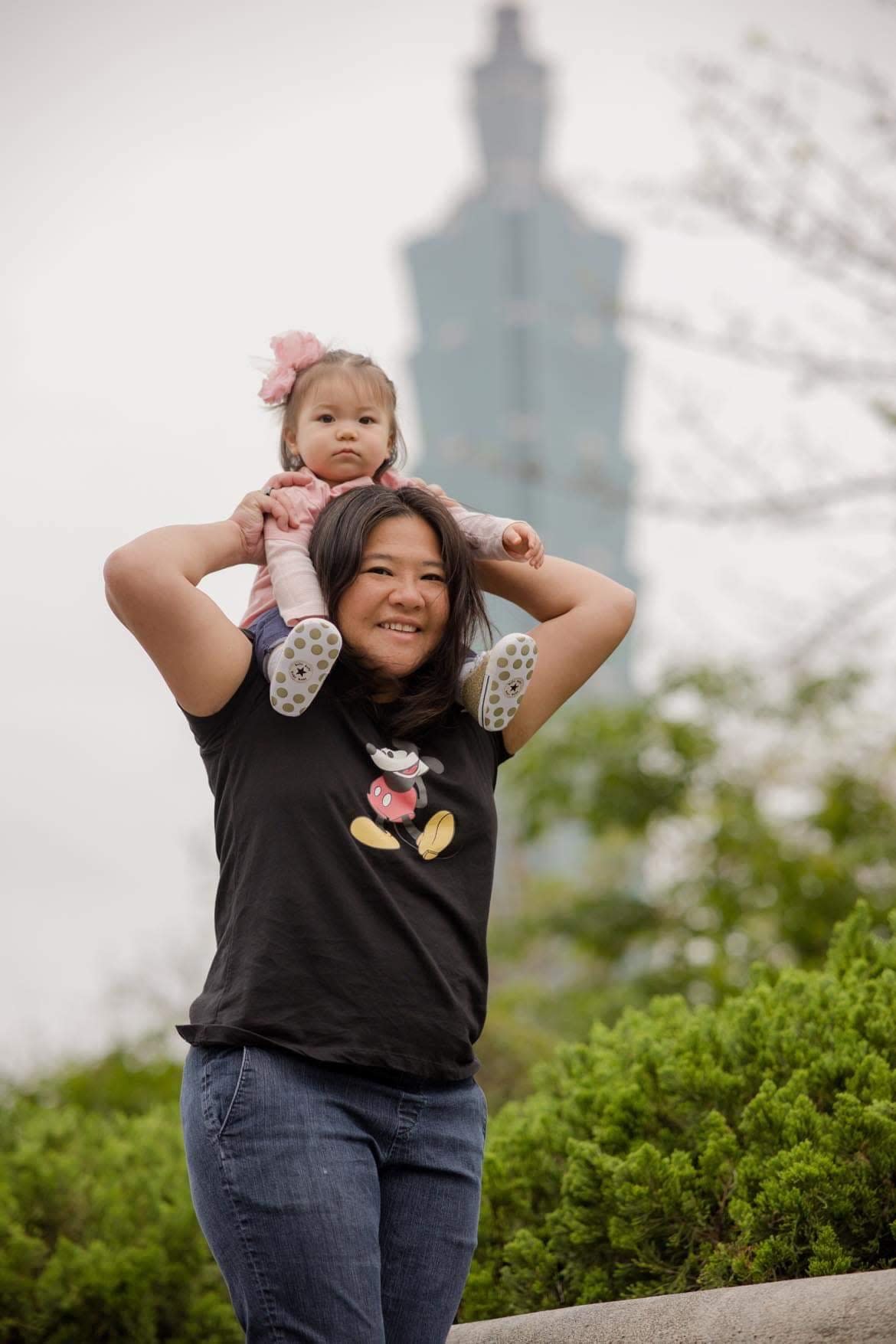 Leann Luong, from Bremerton, shown carrying her daughter, works at the American Institute of Taiwan as a Navy Programs Officer. She provides management support for the Taiwan Navy and Marine Corps and serves as a principal interface between Taiwan Navy and Marine Corps and the U.S. Navy and Marine Corps.