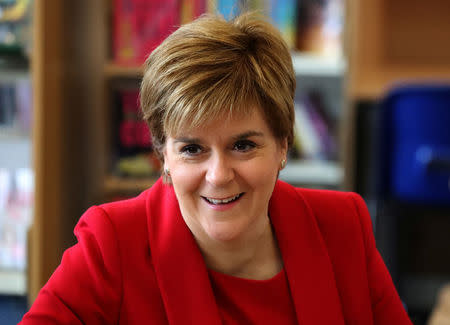 Scotland's First Minister Nicola Sturgeon visits St Andrew's and St Bride's High School to launch the expansion of the First Minister's Reading Challenge to secondary school pupils in East Kilbride, Scotland, Britain August 21, 2017. REUTERS/Andrew Milligan/Pool