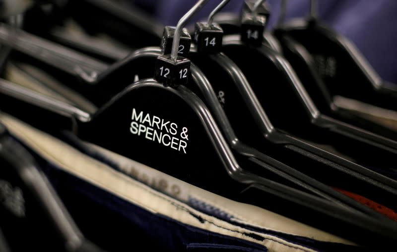 FILE PHOTO: Clothes displayed on hangers in an Marks & Spencer shop in northwest London