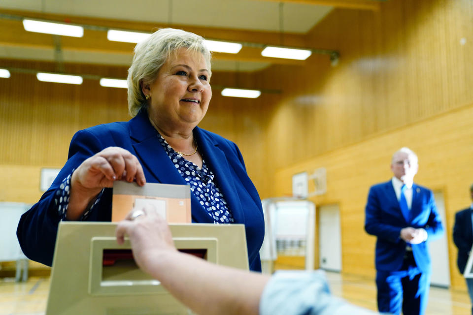 Norway's Prime Minister Erna Solberg, leader of the The Conservative Party Hoyre, casts her ballot in the 2021 parliamentary elections, at Skjold School in Bergen, Norway, Monday, Sept. 13, 2021. Norwegians are heading to the polls on Monday with the ruling Conservatives, led by Prime Minister Erna Solberg, and the opposition Labor Party, which is leading in opinion polls, both advocating for a gradual move away from the use of fossil fuels that continue to underpin the economy. (Hakon Mosvold Larsen/NTB via AP)