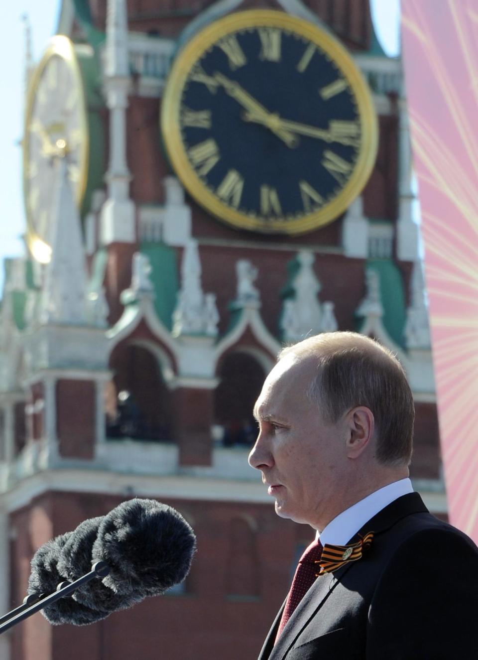 Russian President Vladimir Putin speaks during a Victory Day parade, which commemorates the 1945 defeat of Nazi Germany, at Red Square in Moscow, Russia, Friday, May 9, 2014. Putin made no reference to the situation in Ukraine when he opened Friday's parade, focusing on the historic importance of the victory over Nazi Germany. (AP Photo/RIA-Novosti, Mikhail Klimentyev, Presidential Press Service)