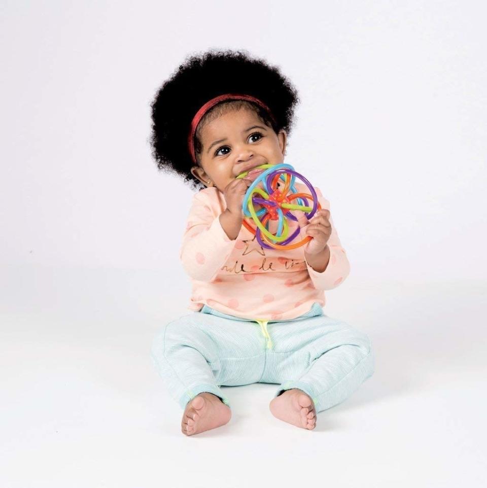 Your baby will learn how to clutch, grasp and listen to sounds with this colorful toy that's also teething-friendly. <br /><br /><strong>Promising Review:</strong> "This toy is awesome, I highly recommend. It was the first toy my daughter was interested in (at about two and a half months).<strong> It seemed to really help develop her grasping ability. She could always get a hold of it and if she accidentally hit herself in the face with it, it didn&rsquo;t hurt her like some of the other little rattles and things she has.</strong> She is now almost five months and still loves to manipulate and chew on it." &mdash; <a href="https://amzn.to/3bWtUAX" target="_blank" rel="nofollow noopener noreferrer" data-skimlinks-tracking="5315000" data-vars-affiliate="Amazon" data-vars-href="https://www.amazon.com/gp/customer-reviews/R2NJNBLORAXEV6?tag=bfjohn-20&amp;ascsubtag=5315000%2C20%2C22%2Cmobile_web%2C0%2C0%2C67735" data-vars-keywords="cleaning,fast fashion,skincare" data-vars-link-id="67735" data-vars-price="" data-vars-product-id="15961778" data-vars-retailers="Amazon">Shelly Owe Noo<br /><br /></a><a href="https://amzn.to/3yGOUW3" target="_blank" rel="noopener noreferrer"><strong>Get it from Amazon for $9.99.</strong></a> 
