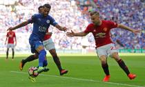 Football Soccer Britain - Leicester City v Manchester United - FA Community Shield - Wembley Stadium - 7/8/16 Leicester City's Riyad Mahrez in action with Manchester United's Luke Shaw Reuters / Eddie Keogh Livepic EDITORIAL USE ONLY. No use with unauthorized audio, video, data, fixture lists, club/league logos or "live" services. Online in-match use limited to 45 images, no video emulation. No use in betting, games or single club/league/player publications. Please contact your account representative for further details.