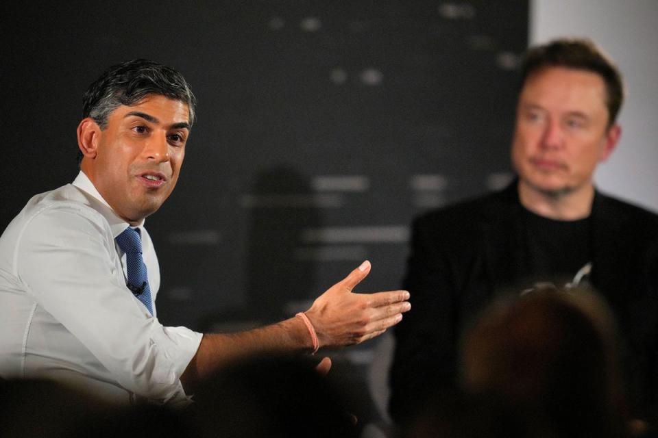 Tesla and SpaceX's CEO Elon Musk listens during an in-conversation event with British Prime Minister Rishi Sunak (L) on November 2, 2023 in London. (Getty Images)