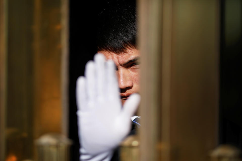 A security officer reacts from inside the Great Hall of the People