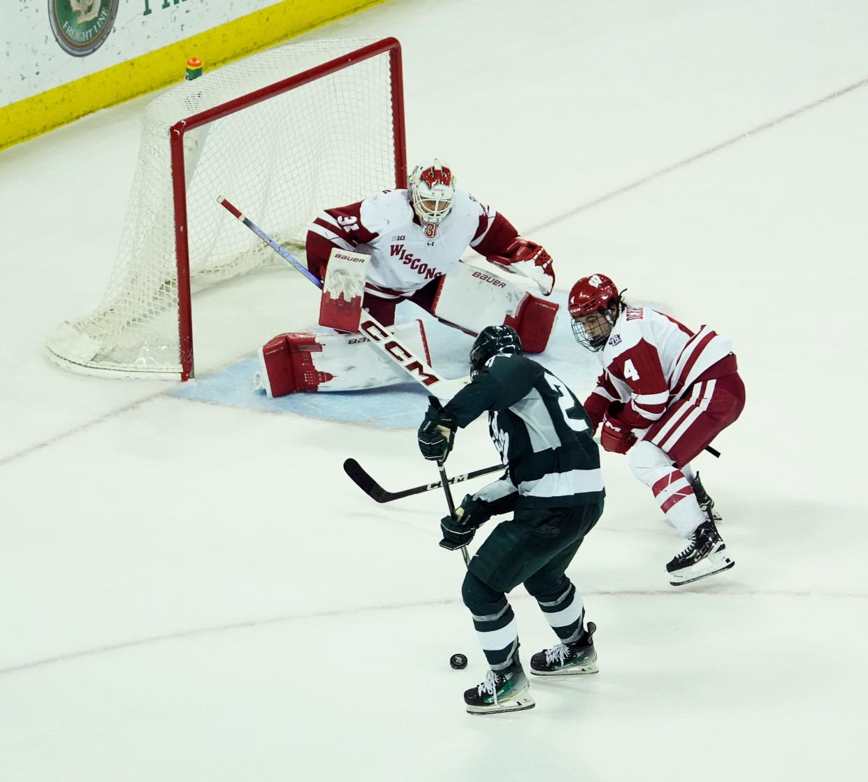 Wisconsin goaltender Kyle McClellan (31) prepares to block the shot from Michigan St. forward Reed Lebster (23) during the second period of their match on Saturday March 2, 2024 at the Kohl Center in Madison, Wis.