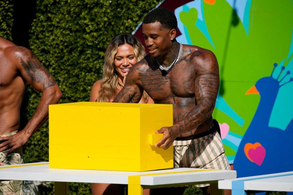 Nadjha Day and Jeff Christian Jr. participate in a peacock-themed challenge on Season 4, Episode 32, of "Love Island."