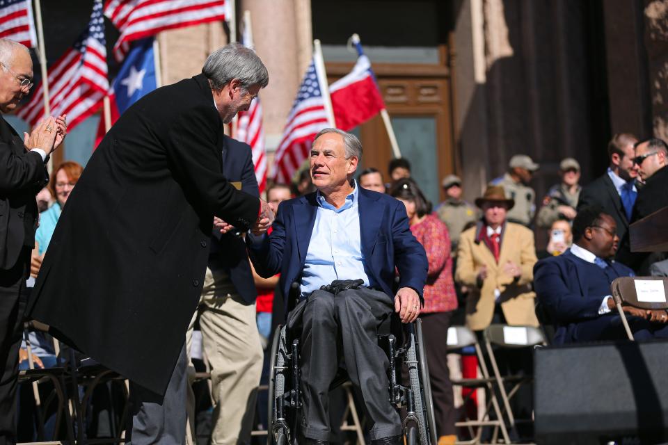Gov. Greg Abbott is greeted by Texas Alliance for Life Executive Director Joe Pojman outside the Capitol at the Texas Rally for Life on Jan. 22, 2022. Anti-abortion groups, including Texas Alliance for Life, say they are interested in learning more about abortion-related complications.
