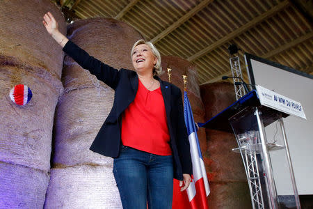 FILE PHOTO: Marine Le Pen, French National Front (FN) political party leader and candidate for the 2017 French presidential election, attends a meeting in a farm in La Trinite-Porhoet, France March 30, 2017. REUTERS/Stephane Mahe/File Photo