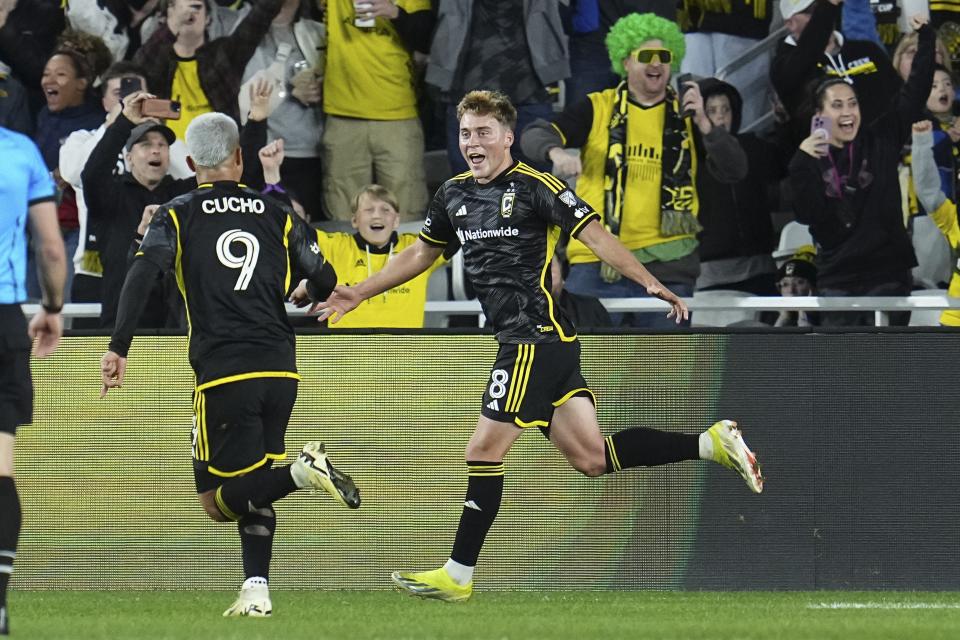 Mar 16, 2024; Columbus, Ohio, USA; Columbus Crew midfielder Aidan Morris (8) celebrates a goal with forward Cucho Hernandez (9) during the second half of the MLS soccer match against the New York Red Bulls at Lower.com Field. Mandatory Credit: Adam Cairns-USA TODAY Sports