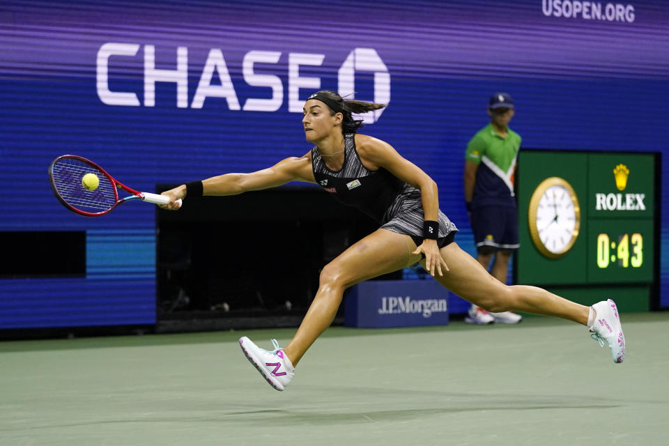 Caroline Garcia, of France, returns to Coco Gauff, of the United States, during the quarterfinals of the U.S. Open tennis championships, Tuesday, Sept. 6, 2022, in New York. (AP Photo/Charles Krupa)