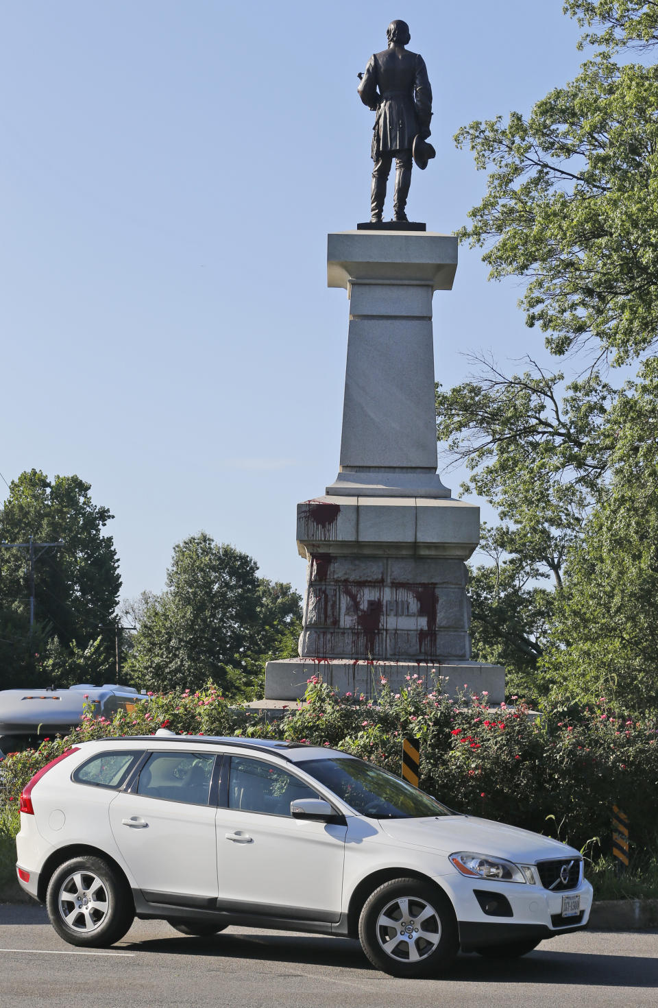 Cars pass by a statue of Confederate General A. P. Hill that was vandalized overnight in Richmond, Va., Wednesday, Aug. 22, 2018. Richmond has been debating what to do with its most prominent Confederate monuments along Monument Avenue in a different part of the city. The Hill statue hasn't been part of that discussion. (AP Photo/Steve Helber)