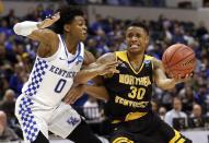 <p>Northern Kentucky’s Lavone Holland II (30) heads to the basket past Kentucky’s De’Aaron Fox during the second half of a first-round game in the men’s NCAA college basketball tournament Saturday, March 18, 2017, in Indianapolis. Kentucky won 79-70. (AP Photo/Jeff Roberson) </p>