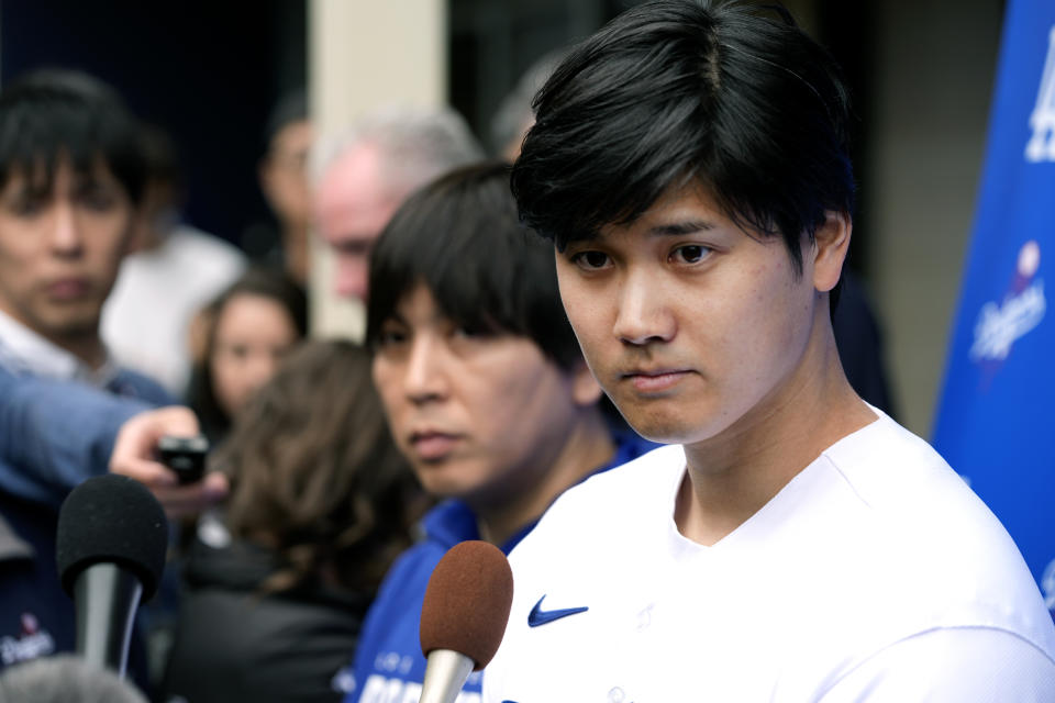 Los Angeles Dodgers' Shohei Ohtani talks to the media at Dodger Stadium during DodgerFest on Saturday, Feb. 3, 2024 in Los Angeles. (AP Photo/Richard Vogel)