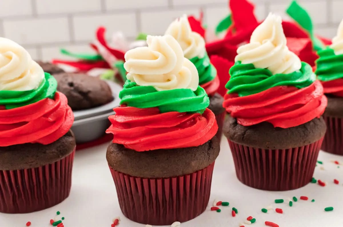 <p>Two Sisters</p><p>The delicious red, green and white Buttercream frosting on these Christmas cupcakes will make them a stand out at any party.</p><p><strong>Get the recipe: <a href="https://www.twosisterscrafting.com/christmas-swirl-cupcakes/" rel="nofollow noopener" target="_blank" data-ylk="slk:Christmas Swirl Cupcakes;elm:context_link;itc:0;sec:content-canvas" class="link rapid-noclick-resp">Christmas Swirl Cupcakes</a></strong></p>