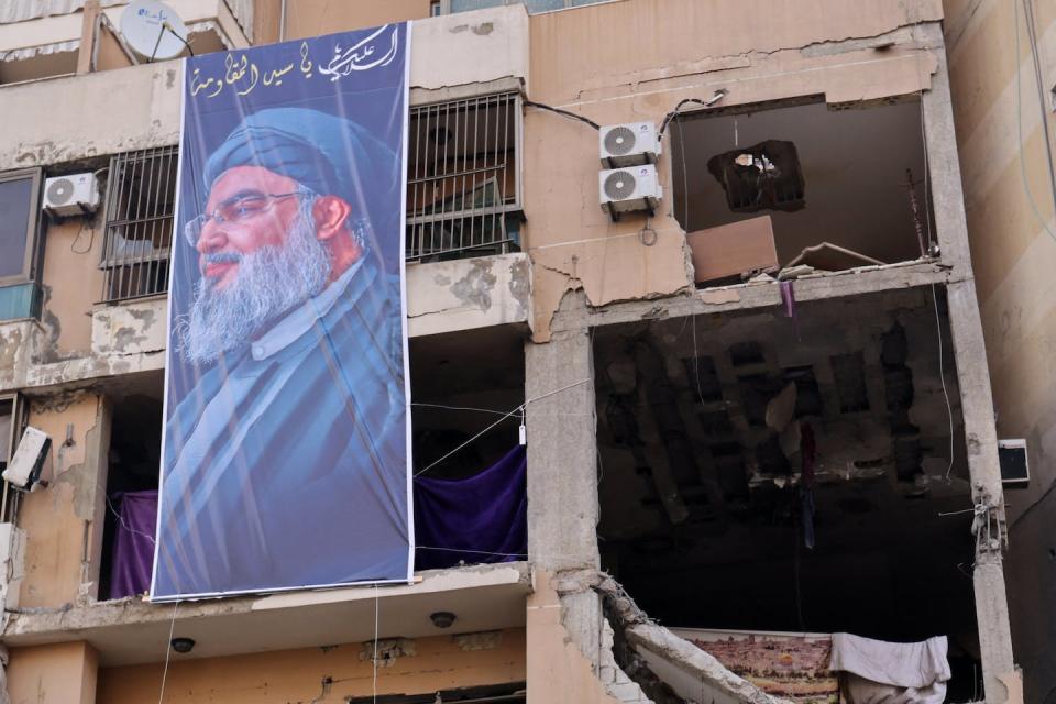 A banner of Hezbollah Secretary General Hassan Nasrallah hangs on the Beirut site where a Hamas leader was killed in an Israeli attack. <a href="https://www.gettyimages.com/detail/news-photo/this-photograph-taken-on-january-8-2024-shows-a-banner-news-photo/1908219508?adppopup=true" rel="nofollow noopener" target="_blank" data-ylk="slk:Anwar Amro/AFP via Getty Images;elm:context_link;itc:0;sec:content-canvas" class="link ">Anwar Amro/AFP via Getty Images</a>