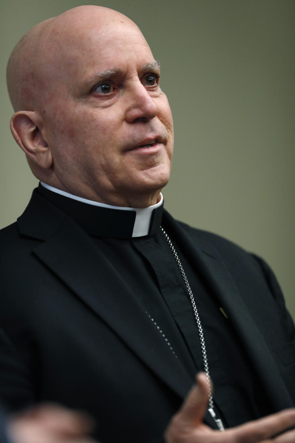 Samuel Aquila, archbishop of the Denver diocese of the Roman Catholic Church, speaks about the plan to have a former federal prosecutor review the sexual abuse files of Colorado's Roman Catholic dioceses at a news conference Tuesday, Feb. 19, 2019, in Denver. The church will pay reparations to victims under a voluntary joint effort with the state attorney general. (AP Photo/David Zalubowski)