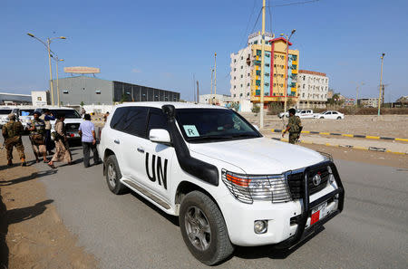 FILE PHOTO: The convoy of a team from the United Nations and the World Food Program crosses from Houthi-controlled areas to a government-controlled areas to reach grain mills in an eastern suburb of Hodeidah, Yemen February 26, 2019. REUTERS/Abduljabbar Zeyad/File Photo