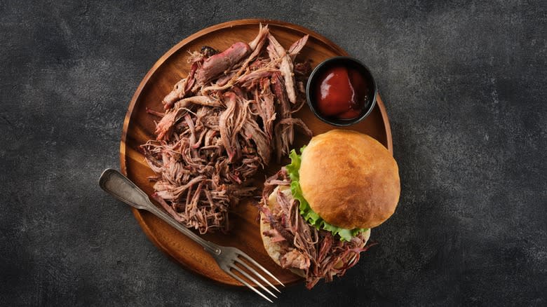 Pulled pork on wooden dish