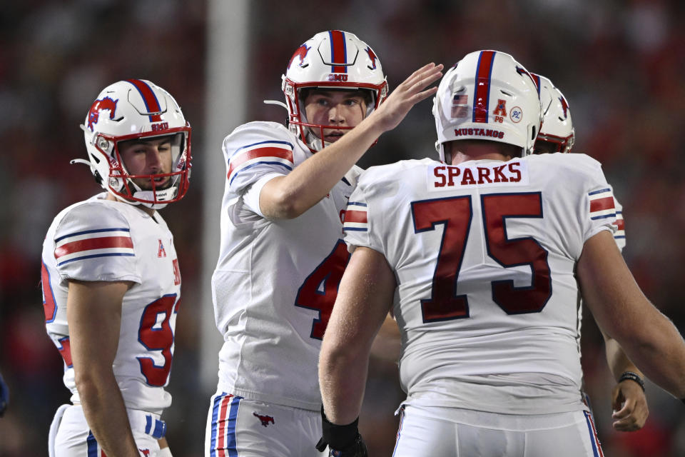 SMU kicker Collin Rogers, center, is congratulated after kicking a field goal against Maryland in the first half of an NCAA college football game, Saturday, Sept. 17, 2022, in College Park, Md. (AP Photo/Gail Burton)