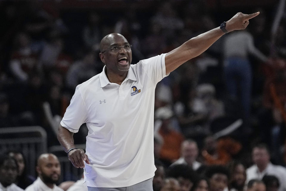 UNC Greensboro coach Mike Jones signals to players during the first half of an NCAA college basketball game against Texas in Austin, Texas, Friday, Dec. 29, 2023. (AP Photo/Eric Gay)