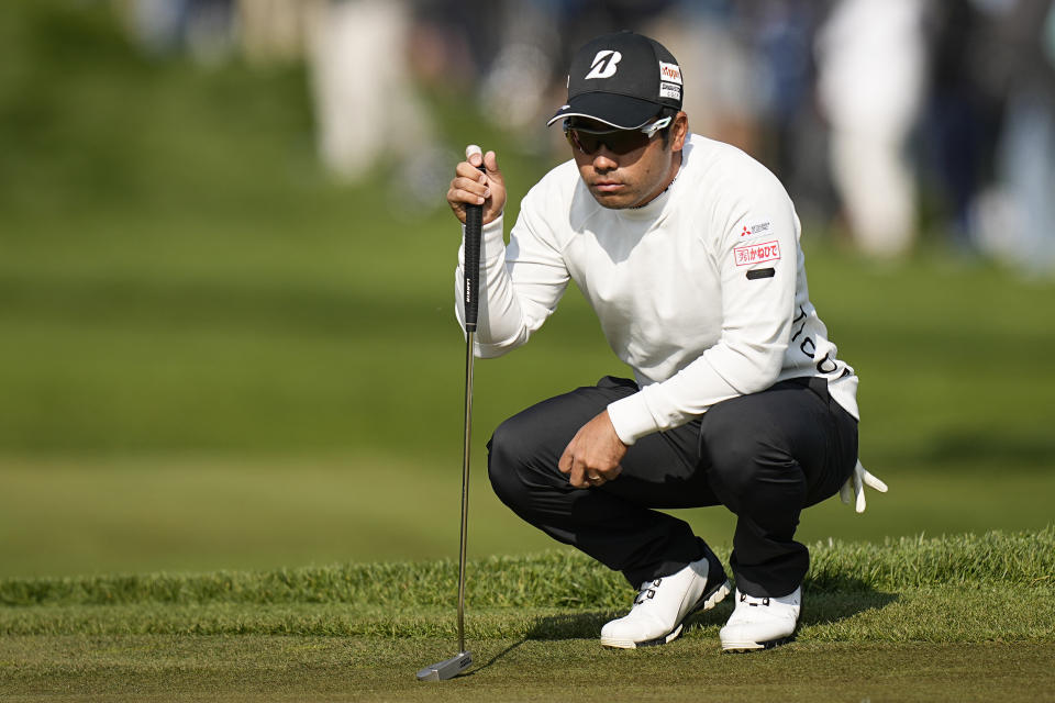 Kazuki Higa, of Japan, lines up a putt on the 10th hole during the first round of the PGA Championship golf tournament at Oak Hill Country Club on Thursday, May 18, 2023, in Pittsford, N.Y. (AP Photo/Eric Gay)