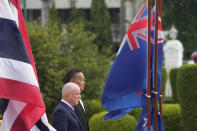 New Zealand's Prime Minister Christopher Luxon, foreground, escorted by Thailand's Prime Minister Srettha Thavisin, listens to national anthems during a welcoming ceremony at the Government House in Bangkok, Thailand, Wednesday, April 17, 2024. (AP Photo/Sakchai Lalit)