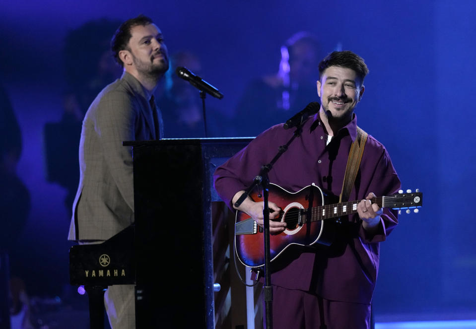 Ben Lovett, left, and Marcus Mumford of Mumford & Sons perform at MusiCares Person of the Year honoring Berry Gordy and Smokey Robinson at the Los Angeles Convention Center on Friday, Feb. 3, 2023. (AP Photo/Chris Pizzello)