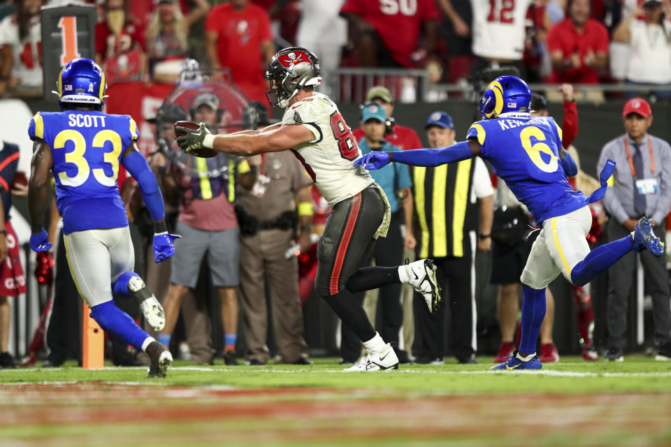 TAMPA, FL - NOVEMBER 6: Cade Otton #88 of the Tampa Bay Buccaneers carries the ball over the goal line to score a touchdown during the fourth quarter of an NFL football game against the Los Angeles Rams at Raymond James Stadium on November 6, 2022 in Tampa, Florida. (Photo by Kevin Sabitus/Getty Images)