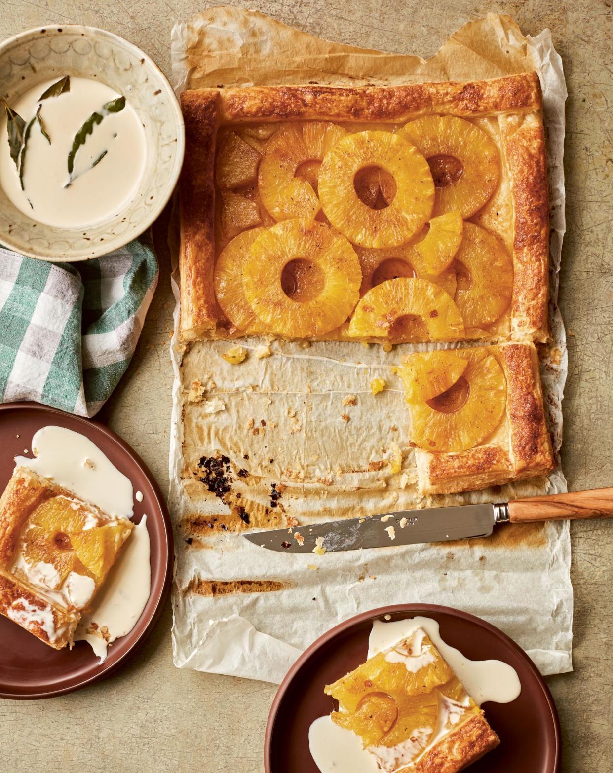 <span>Benjamina Ebuehi’s spiced pineapple tart with bay cream.</span><span>Photograph: Laura Edwards/Quadrille. Food styling: Benjamina Ebuehi. Prop styling: Anna Wilkins. Plates: Aaron Probyn.</span>