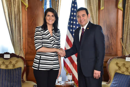 U.S. Ambassador to the United Nations Nikki Haley shakes hands with Guatemalan President Jimmy Morales at the National Palace in Guatemala City, Guatemala, February 28, 2018. Guatemalan Presidency/Handout via REUTERS