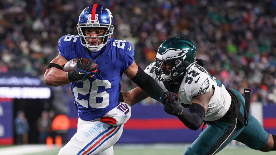 Barkley breaks a tackle by Philadelphia Eagles linebacker Zach Cunningham to rush for a touchdown. - Vincent Carchietta/USA Today Sports/Reuters