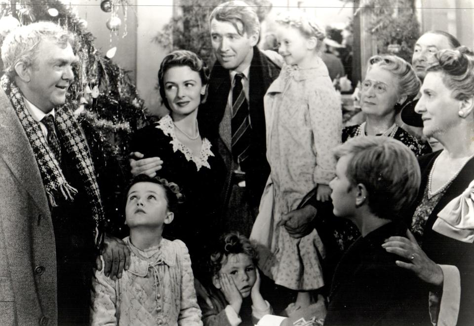 "It's a Wonderful Life," NBC Movie of the Week. Pictured left to right, (back row), Thomas Mitchell, Donna Reed, James Stewart, Karolyn Grimes, two extras, Beulah Bondi; (front row) Carol Coomes, Jimmy Hawkins, Larry Simms. James Stewart and Donna Reed star in Frank Capra's 1946 holiday classic that chronicles the life of George Bailey (Stewart), a troubled businessman who attempts suicide one Christmas Eve, and is given another chance in life by as second-class angel who shows him the value of life.