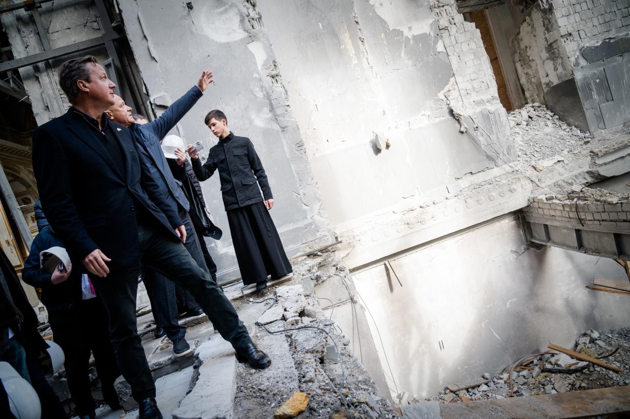 Lord Cameron inspects the damaged Transfiguration Cathedral in Odesa, Ukraine (PA)