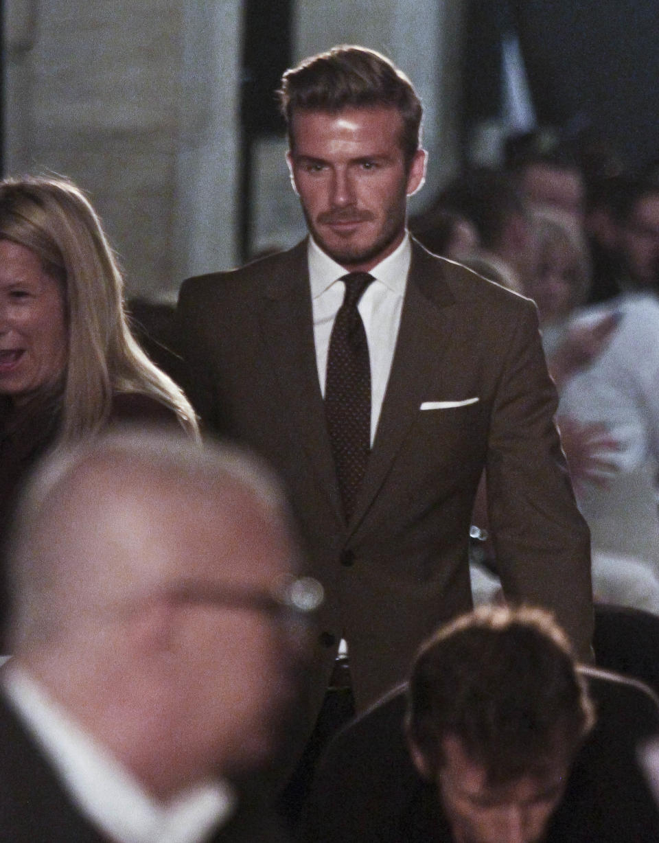 David Beckham arrives at the show for Victoria Beckham's Spring 2013 fashion collection on Sunday, Sept. 9, 2012 in New York. (AP Photo/Bebeto Matthews)