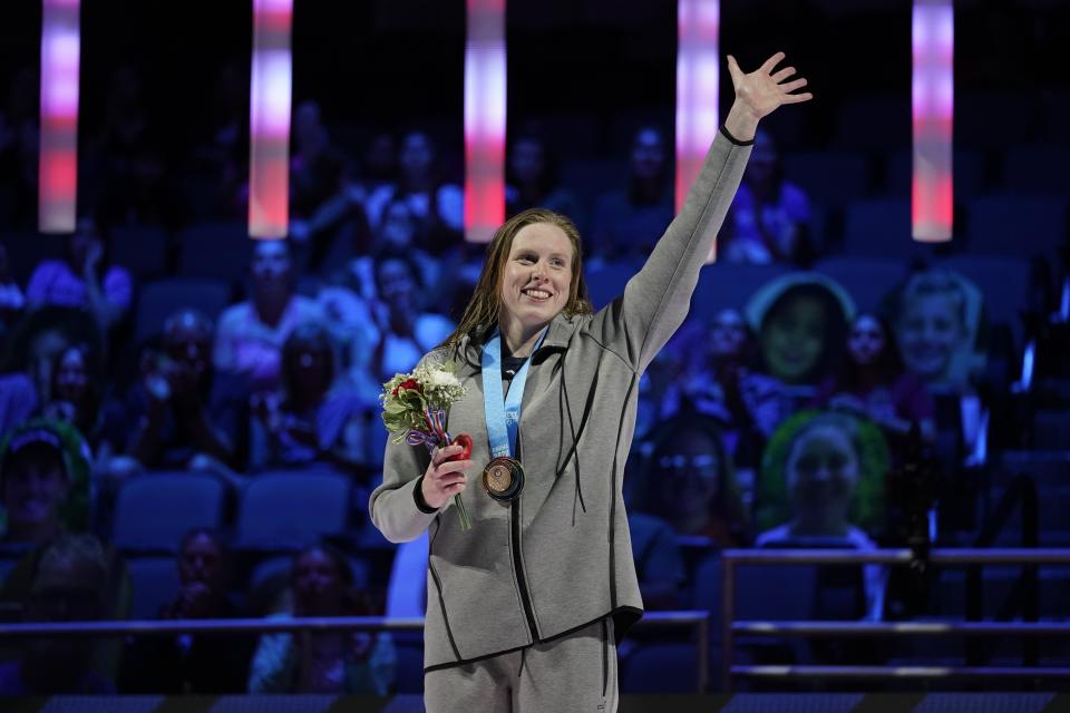 Lilly King waves at the awards ceremony after winning the women's 100 breaststroke during wave 2 of the U.S. Olympic Swim Trials on Tuesday, June 15, 2021, in Omaha, Neb. (AP Photo/Charlie Neibergall)